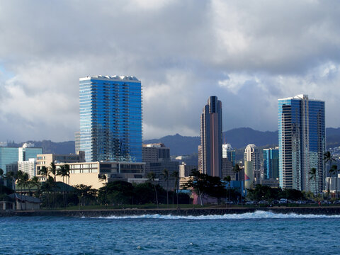 Wave crashes against rock seawall at Kaka`ako Waterfront Park
