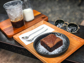 Dark chocolate brownies served with coffee