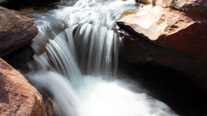 waterfall in a river with silk teepee water