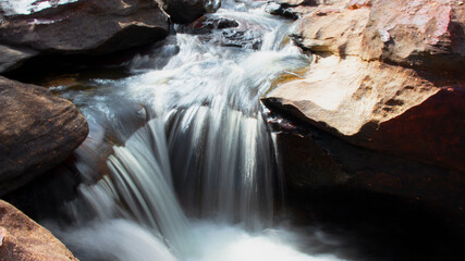 waterfall in a river with silk teepee water