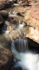 waterfall in a river with silk teepee water