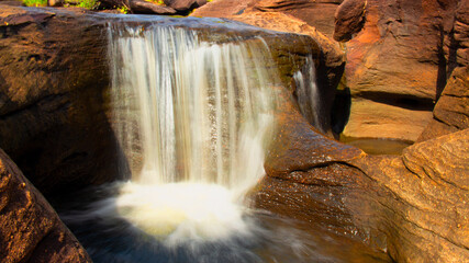 waterfall in a river with silk teepee water