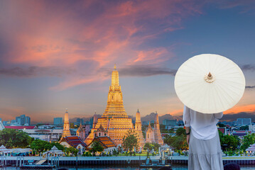 The back of an old women fashion paper umbrella Large golden chinese dragon Travel photos jpg