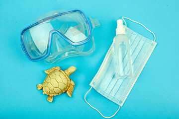 scuba diving mask for swimming and disinfection, virus protection, symbol of summer 2020, the concept of summer holidays in a pandemic and isolation, fighting and protection against the virus