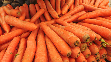 Portion of carrots in supermarket display.