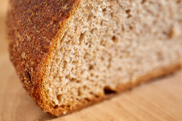 Loaf of sourdough, whole grain bread sliced open to reveal the inner crumb. Pennsylvania, USA