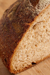 Loaf of sourdough, whole grain bread sliced open to reveal the inner crumb. Pennsylvania, USA