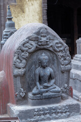 The statue of Buddha beside the Swayambhunath Stupa, Kathmandu, Nepal the World Heritage site declared by UNESCO