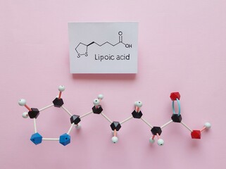Structural chemical formula and molecular structure model of lipoic acid. Lipoic acid (ALA,...