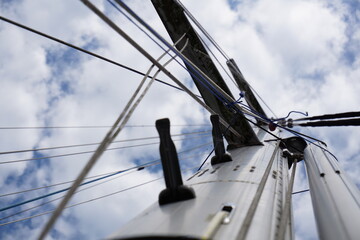 Sturdy reliable mast of sailing boat photographed from below.

