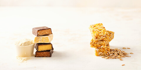 Different Energy protein bars and oatmeal bars on light background.   Set of energy, sport, breakfast and protein bars