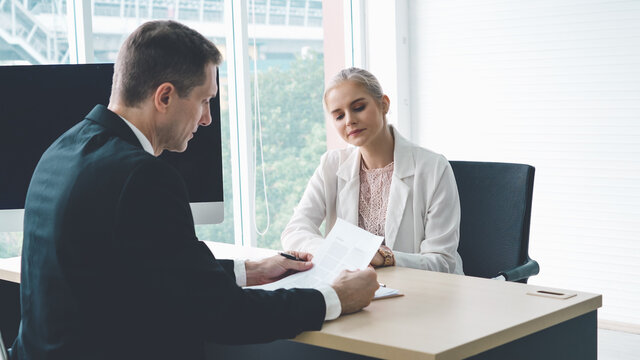 Job seeker in job interview meeting with manager and interviewer at corporate office. The young interviewee seeking for a professional career job opportunity . Human resources and recruitment concept.