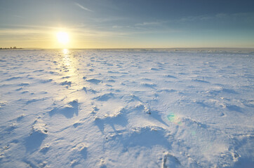 Winter landscape. Ice on water surface.