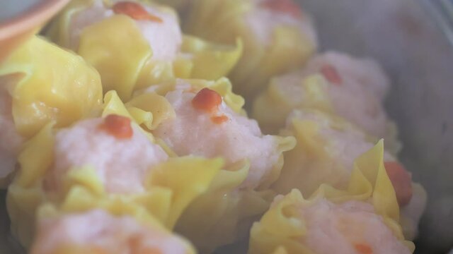 Steaming Dumpling dim sum in the hot pot, selective focus shallow depth of field