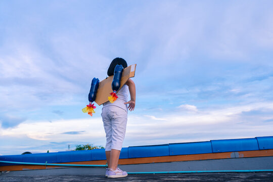 Learning New Things, Child Pretend To Be Businessman. Kid Playing At Home. Imagination, Idea And Creative Concept. The Girl Who Has A Year Of Swagger Flying Over The City, Business Advantage Concept.