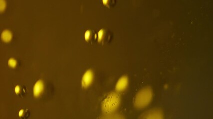 Fresh beer foam bubbled glass texture macro slow motion
