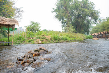 Nature of beautiful river flow with cottage beside