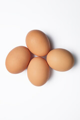 Four isolated chicken eggs