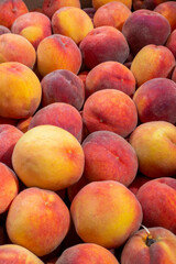 Background and texture of ripe peaches. Close-up.