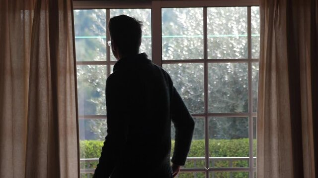 man looking at  window slow motion