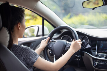 Fototapeta na wymiar Female drivers drive cars