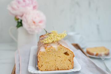sweet home made elderflower sponge cake on a table