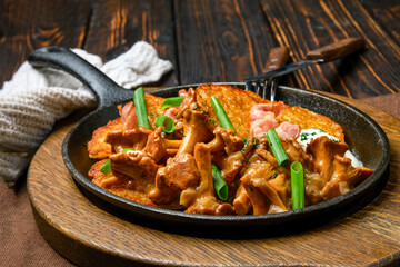 Potato pancakes with chanterelles and pork