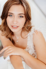 Naklejka premium portrait bride in wedding dress with feathers.