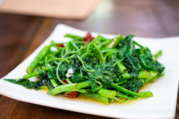 Fried beam seedings with garlic and red pepper, a traditional Sichuan cuisine in China.