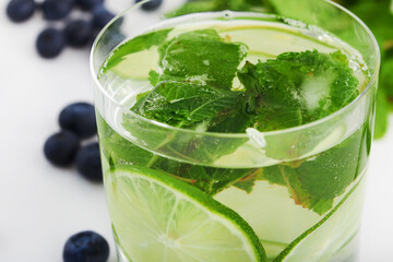 lemonade summer drink with berries and blueberries and mint with lime