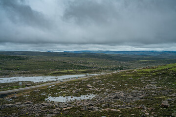 The meadows and rocks on mountains in Haiti Mountain, in Tibet, China, on a cloudy day, summer time.