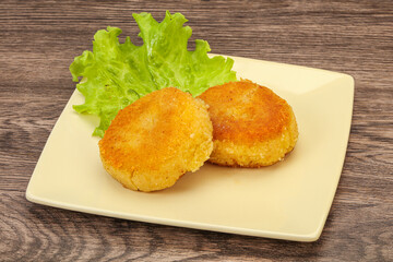 Vegan cuisine - Potato cutlet in the plate