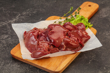 Raw chicken liver over board