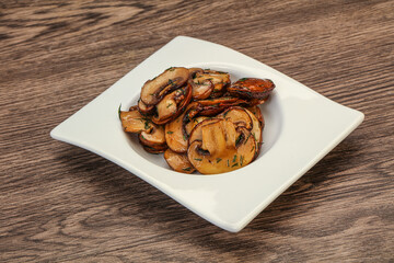 Roasted champignon with herbs and spices