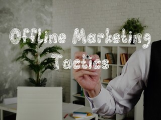 Offline Marketing Tactics phrase on the piece of paper.