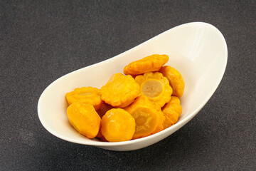 Marinated yellow patisson in the bowl