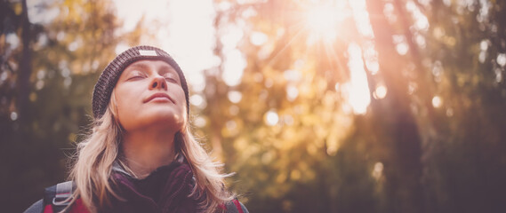 Young woman hiking and going camping in nature