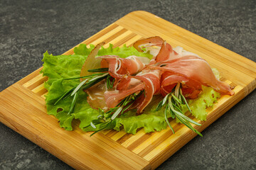 Sliced pork Jamon with rosemary