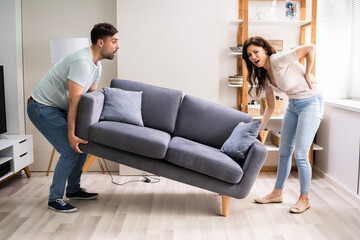 Person Lifting Heavy Furniture Couch Having Injury