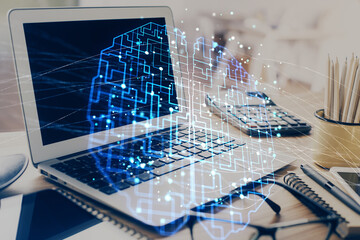 Double exposure of desktop with computer and brain drawing hologram. Artificial intelligence concept.