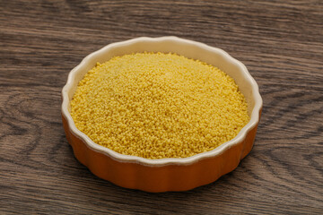 Raw cous cous heap in the bowl