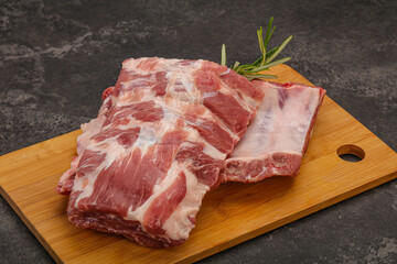 Raw pork ribs served rosemary