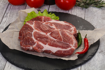 Raw pork neck steak