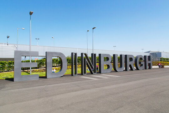 Edinburgh, UK: May 29, 2016: Families Wait For Planes To Arrive Outside The Main Entrance To Edinburgh Airport. Edinburgh Airport Is Located At Ingliston In The City Of Edinburgh.