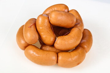 Tasty meat sausages over white background