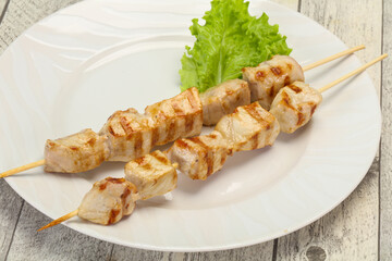 Grilled pork skewer served salad