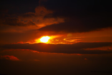 enigmatical sky with dark clouds and in the dusk