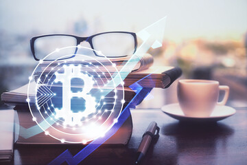 Crypto theme hologram with glasses on the table background. Concept of blockchain. Double exposure.