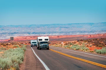 Poster RV Camper Van on the American Road. Exploring the USA. Holiday trip vacation. Motorhome, caravan on a road. Recreational vehicle motor home trailer on road in America. © Volodymyr