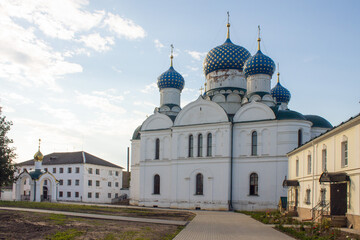 Fototapeta na wymiar White-stone Epiphany monastery in Uglich Russia on a clear summer day and space for copying.